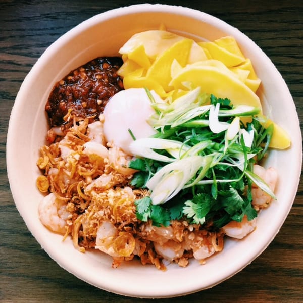 Mighty Bowl's Asian-fusion bowl with shrimp, mango, chili sauce, egg, and green onions.